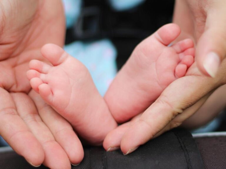 baby-feet-and-adult-hands-